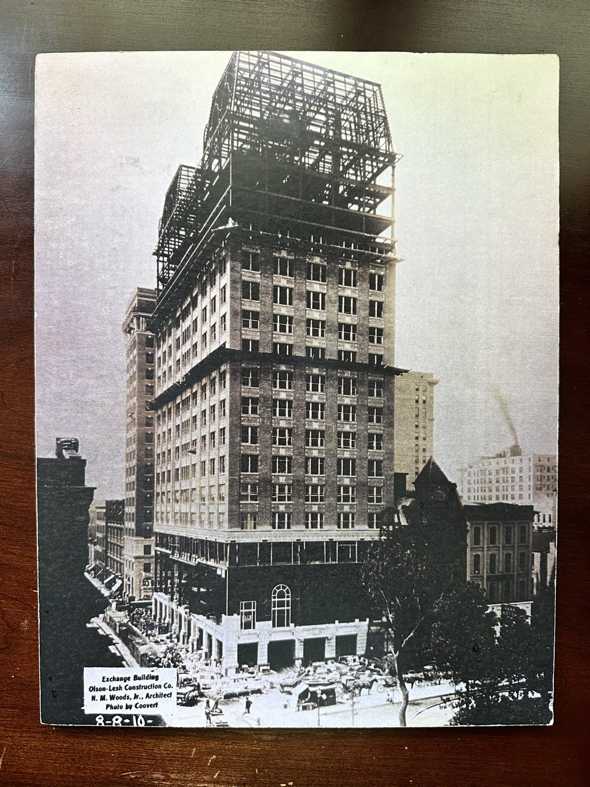 The Exchange Building under construction in 1910 — masonry floors complete and the steel frame rising over downtown Memphis.